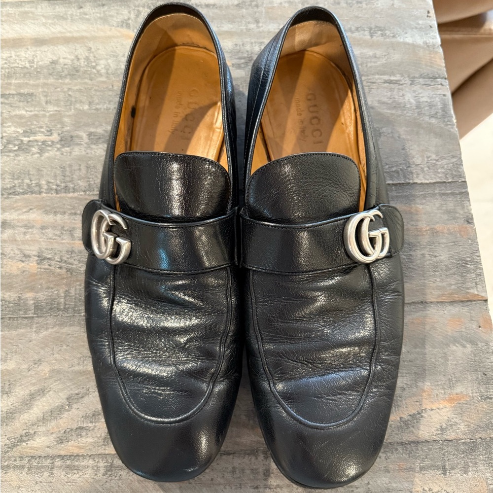 Gucci Black Leather Slip-On Loafers with Silver Emblem
